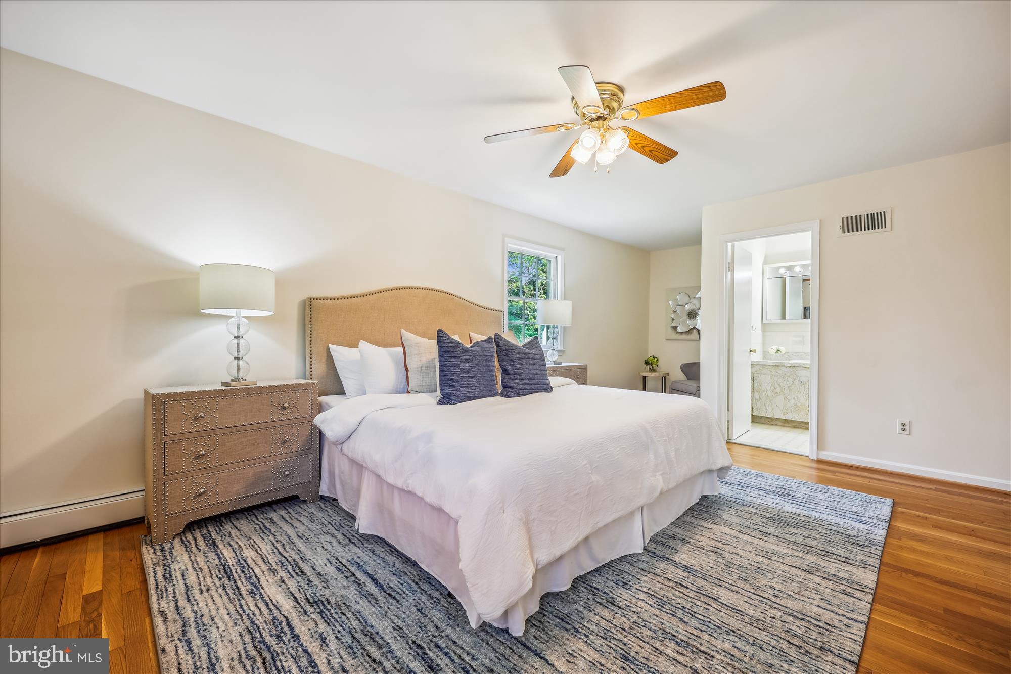 1029 Tracy Drive Silver Spring, MD 20904 - Photo 34 of 59 a bedroom with a large bed and a ceiling fan