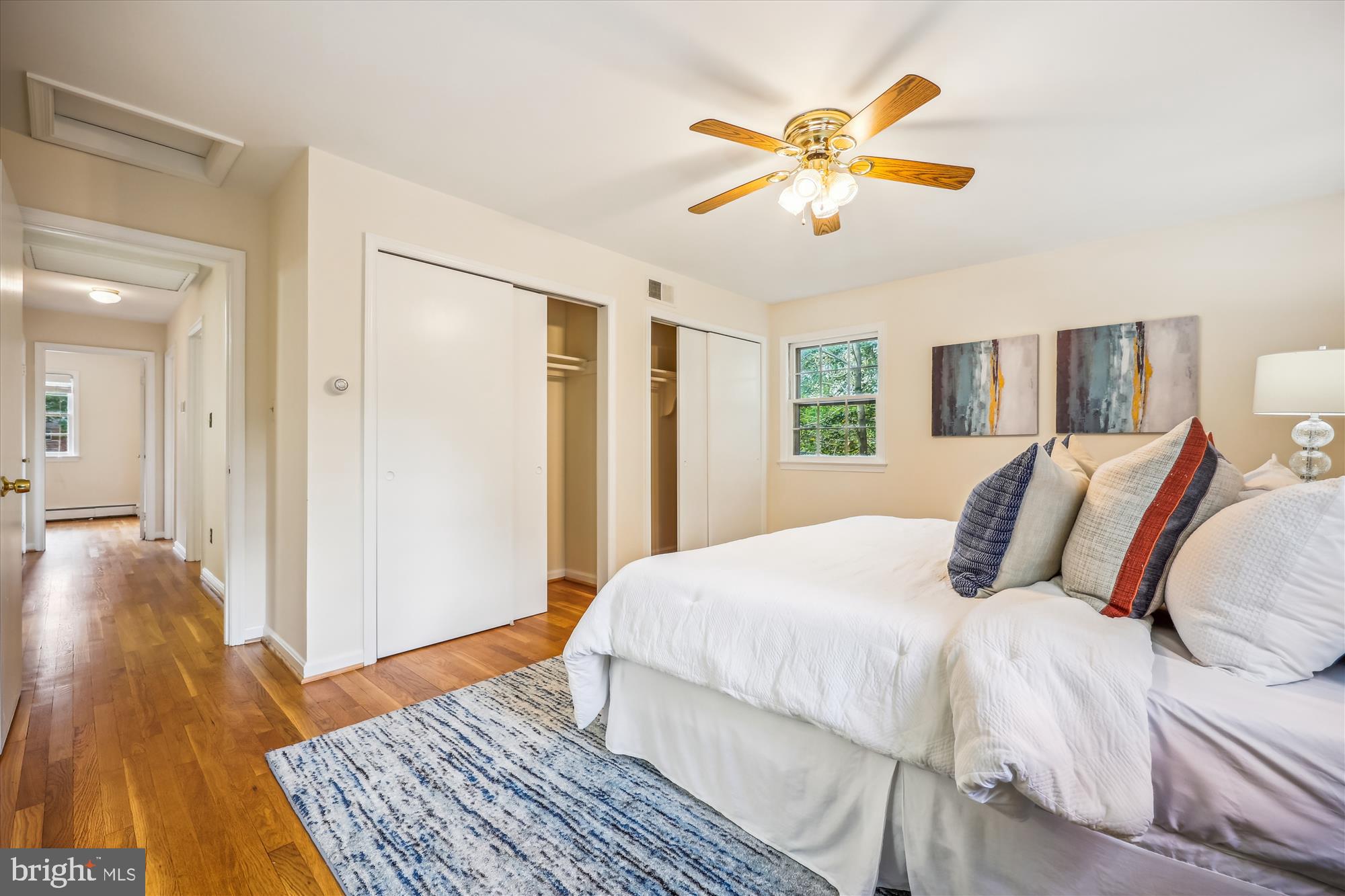 1029 Tracy Drive Silver Spring, MD 20904 - Photo 35 of 59 a bedroom with a large bed and a chandelier