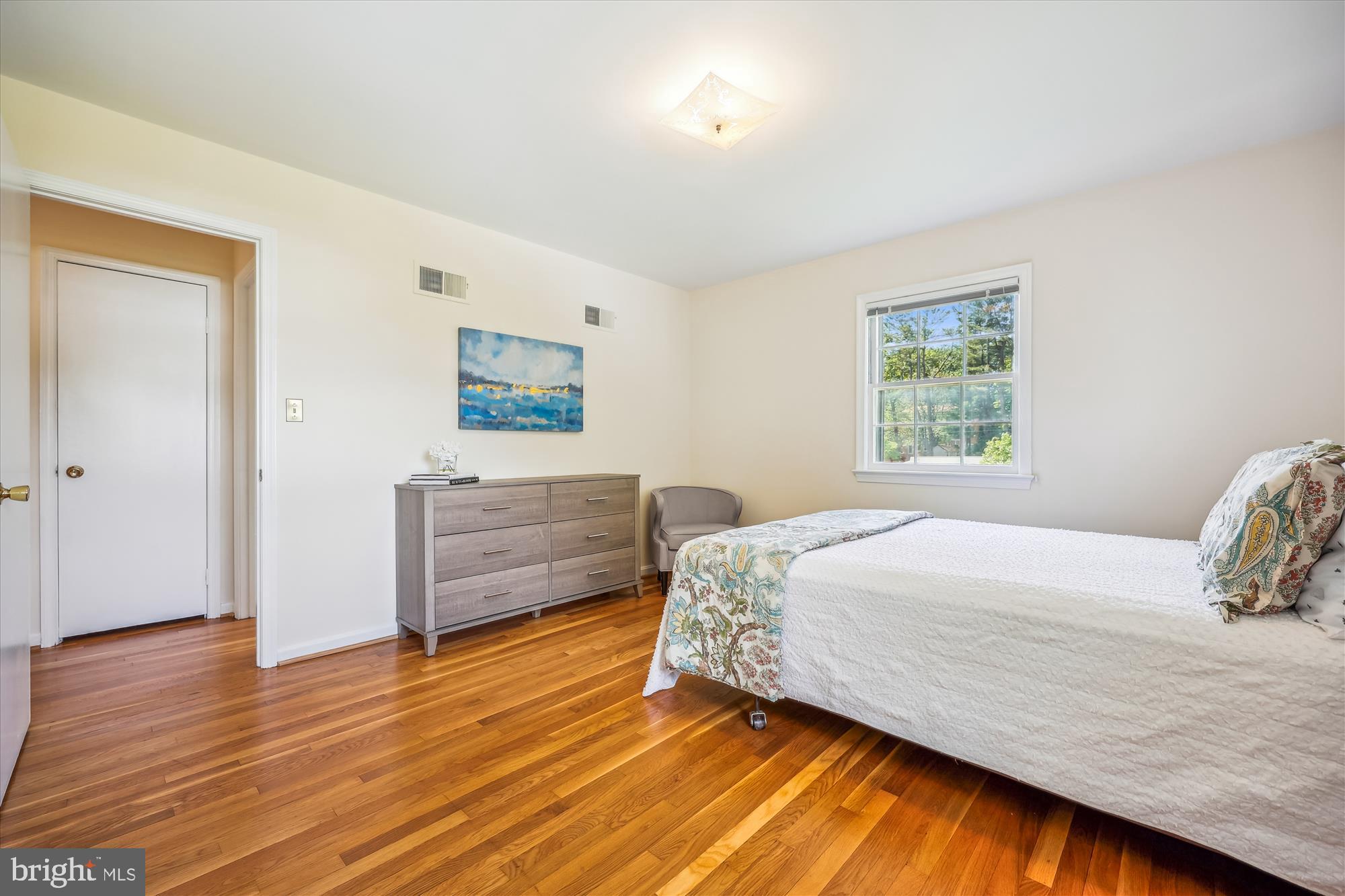 1029 Tracy Drive Silver Spring, MD 20904 - Photo 40 of 59 a bedroom with a bed and a dresser