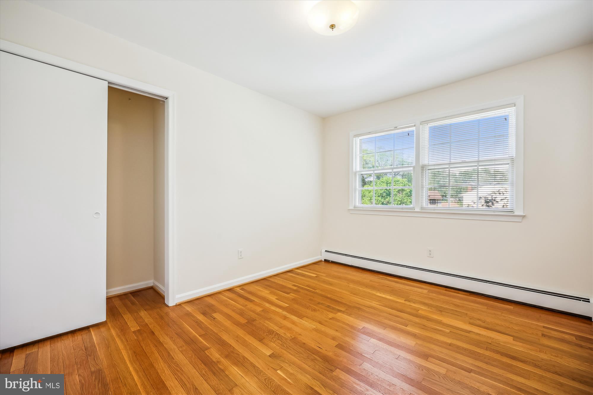 1029 Tracy Drive Silver Spring, MD 20904 - Photo 41 of 59 an empty room with wooden floor and window