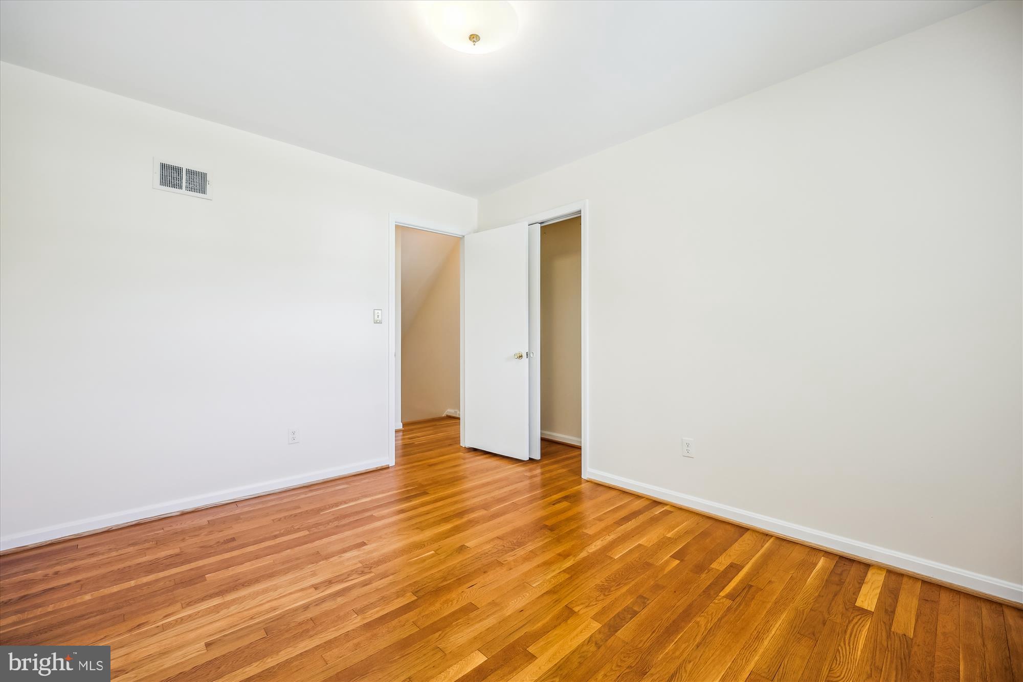 1029 Tracy Drive Silver Spring, MD 20904 - Photo 42 of 59 a view of an empty room with wooden floor