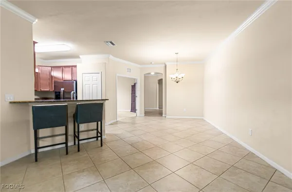 a view of work space with a table and chairs