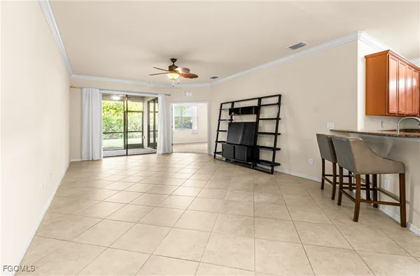 a view of a livingroom with furniture and windows