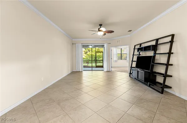 a view of an empty room with a window