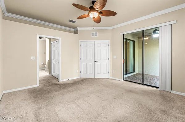 a bathroom with a granite countertop sink a toilet and a mirror