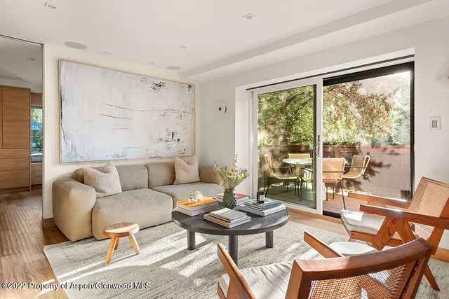 a living room with a couch and a large window