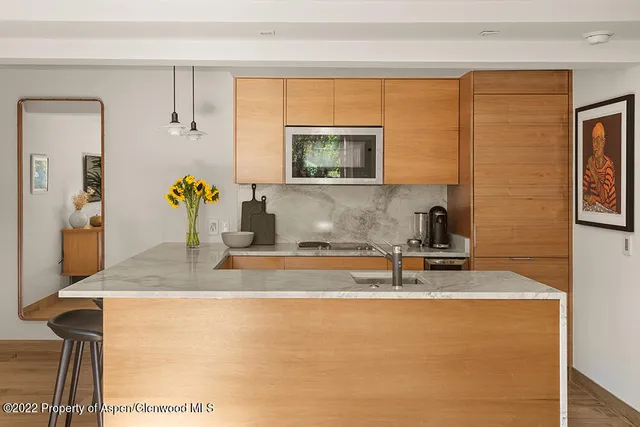 a view of kitchen with furniture and window