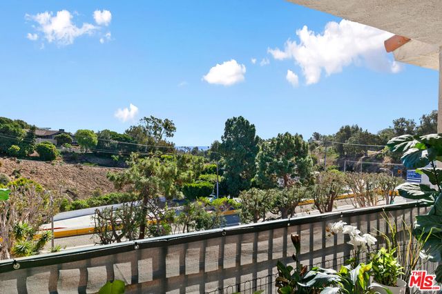 a view of a balcony with a staircase