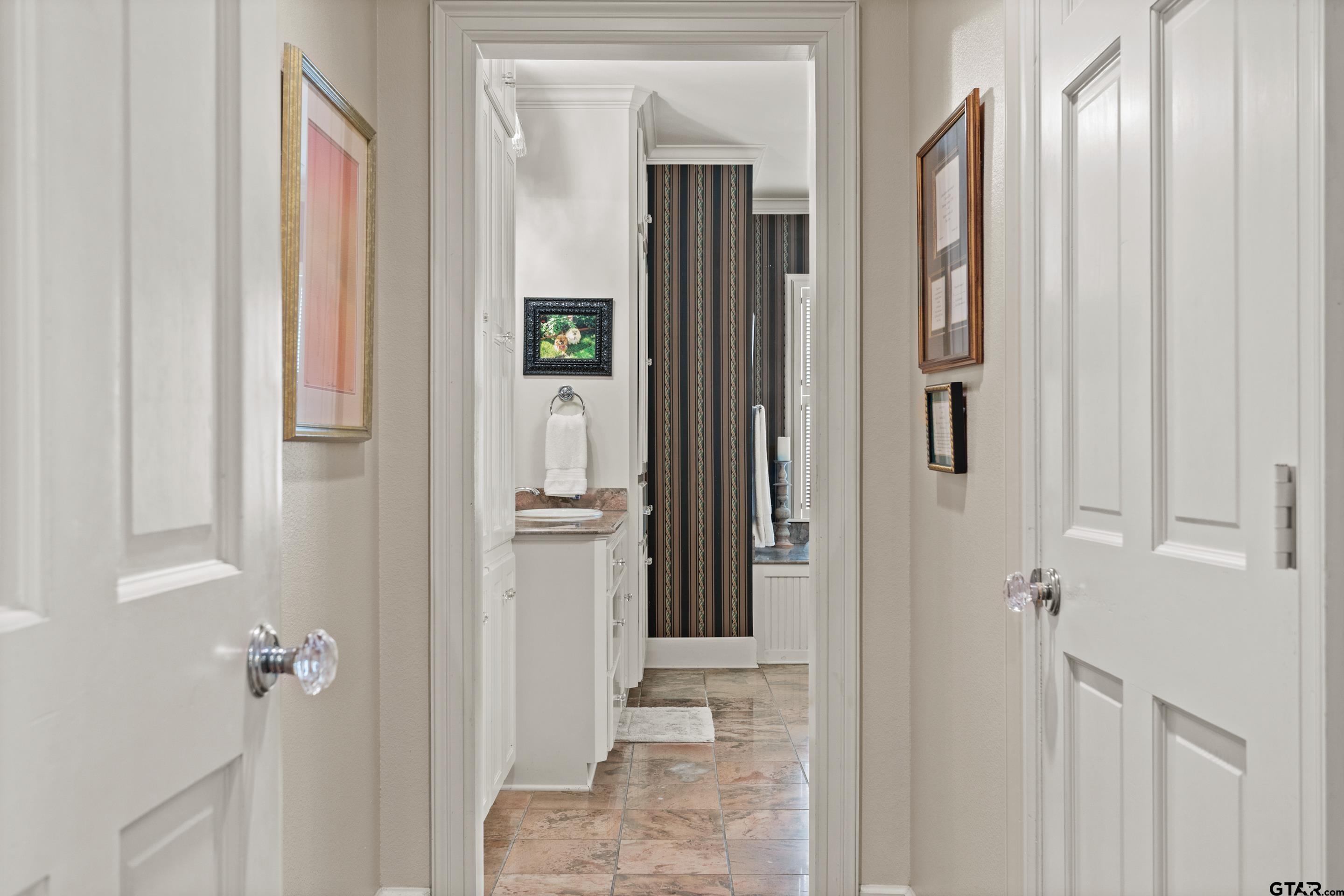 2631 Old Bullard Road Tyler, TX 75701 - Photo 20 of 43 a view of a bathroom from a hallway