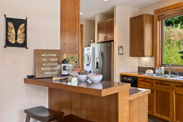 a kitchen with a sink cabinets and refrigerator