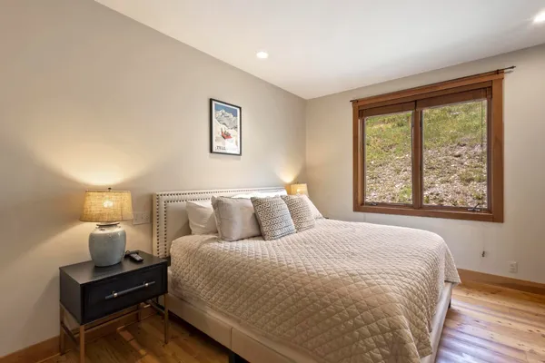 a bed room with a bed and a lamp
