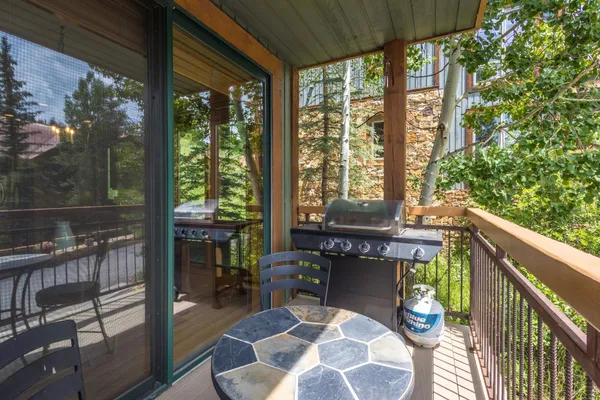 a view of balcony with furniture