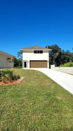 a view of front of house with a yard