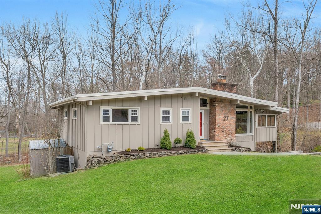 27 Bear Mountain Road Ringwood, NJ 07456 - Photo 1 of 47 a front view of house with yard and green space