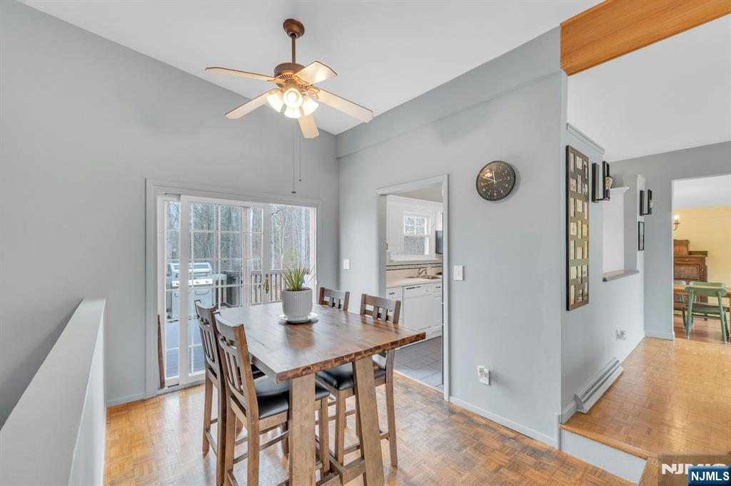 27 Bear Mountain Road Ringwood, NJ 07456 - Photo 11 of 47 a view of a dining room with furniture and wooden floor