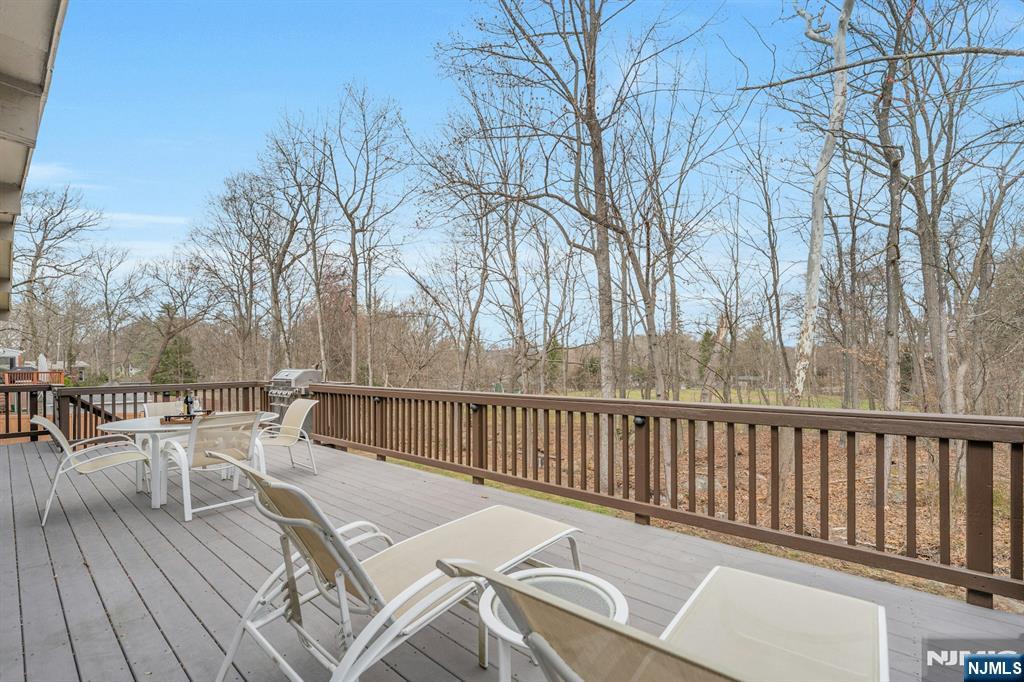 27 Bear Mountain Road Ringwood, NJ 07456 - Photo 13 of 47 a view of a chairs and table on the wooden floor