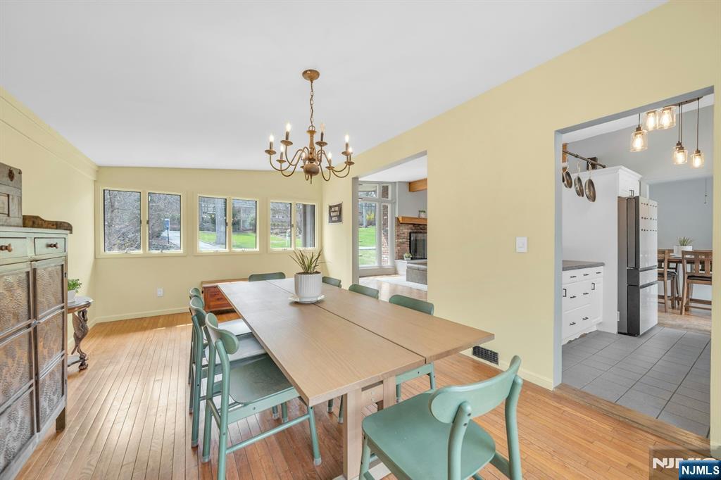 27 Bear Mountain Road Ringwood, NJ 07456 - Photo 18 of 47 a view of a dining room with furniture and wooden floor