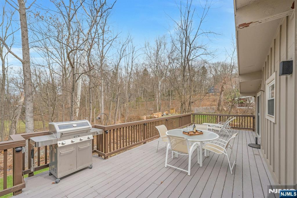 27 Bear Mountain Road Ringwood, NJ 07456 - Photo 22 of 47 a view of a chairs and table on the deck