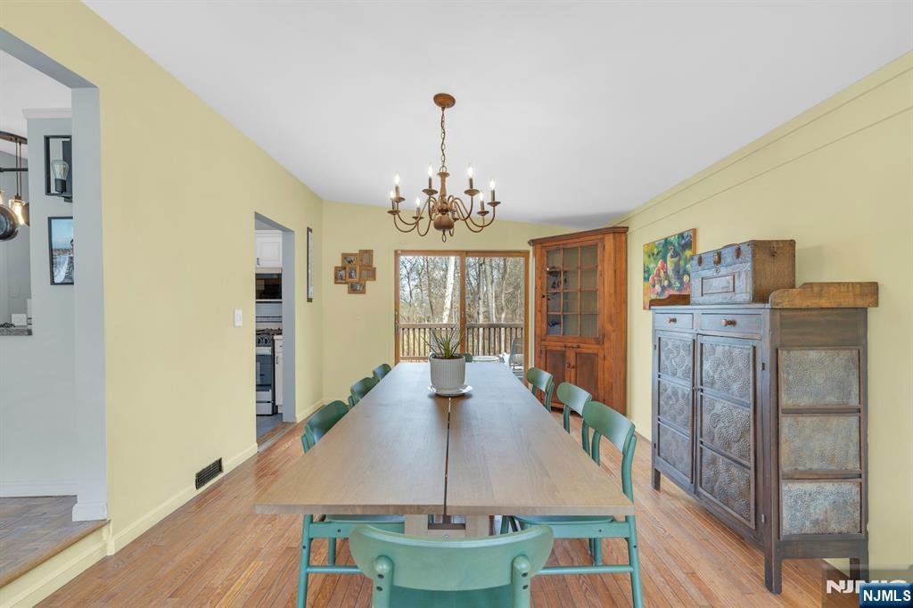 27 Bear Mountain Road Ringwood, NJ 07456 - Photo 23 of 47 a view of a dining room with furniture window and wooden floor