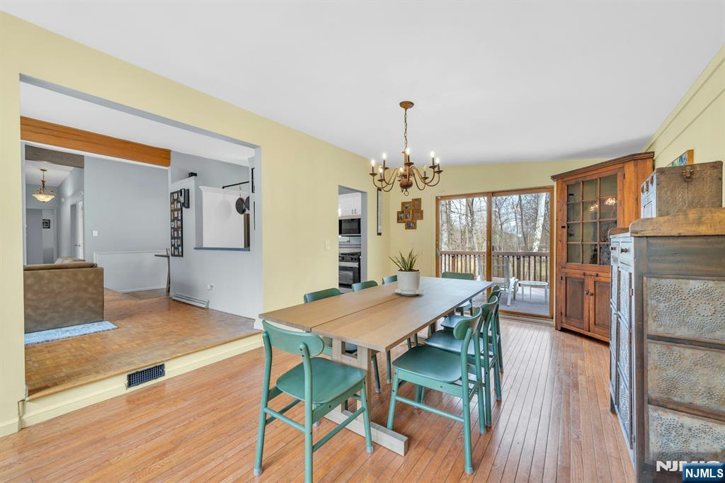27 Bear Mountain Road Ringwood, NJ 07456 - Photo 24 of 47 a view of a dining room with furniture and wooden floor
