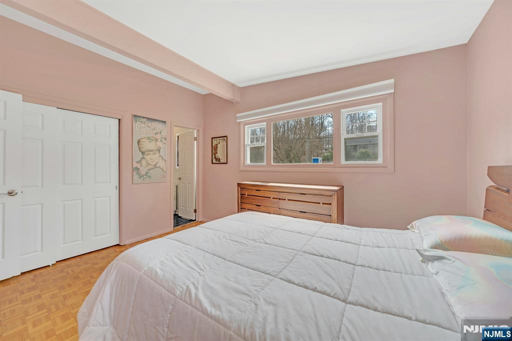 27 Bear Mountain Road Ringwood, NJ 07456 - Photo 26 of 47 a bedroom with a large bed and a window