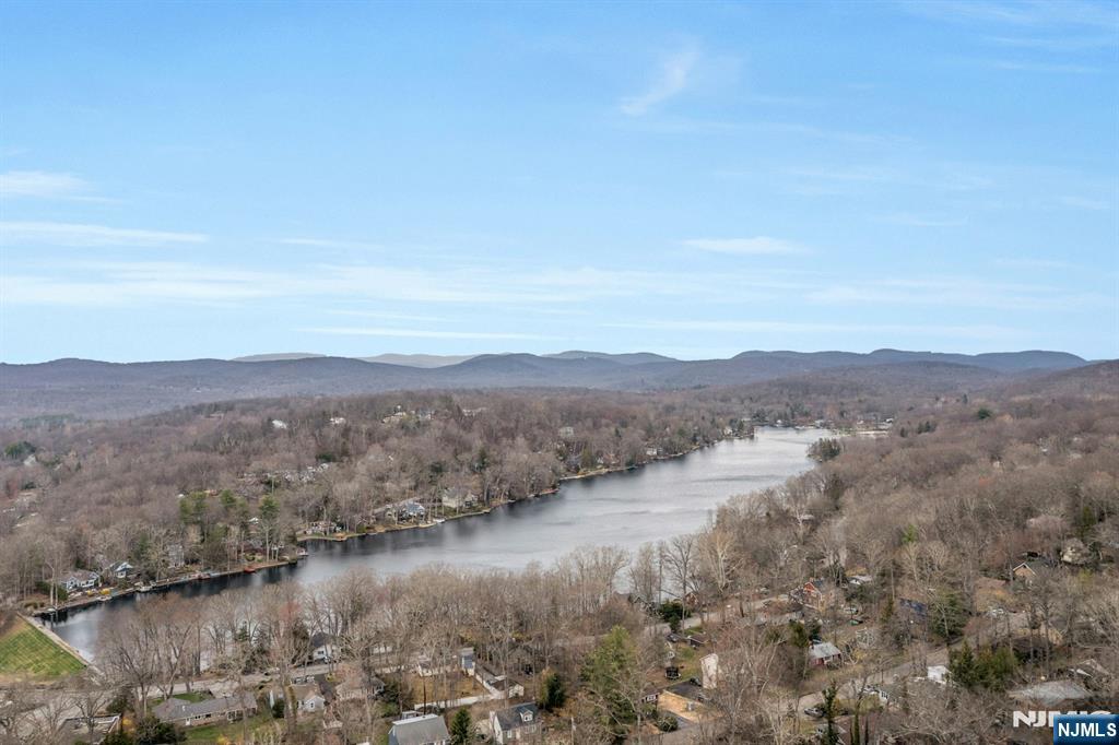 27 Bear Mountain Road Ringwood, NJ 07456 - Photo 3 of 47 a view of lake with mountain