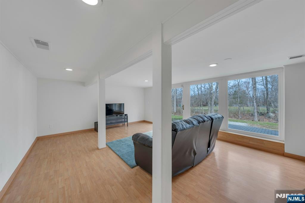 27 Bear Mountain Road Ringwood, NJ 07456 - Photo 32 of 47 a living room with furniture and a large window