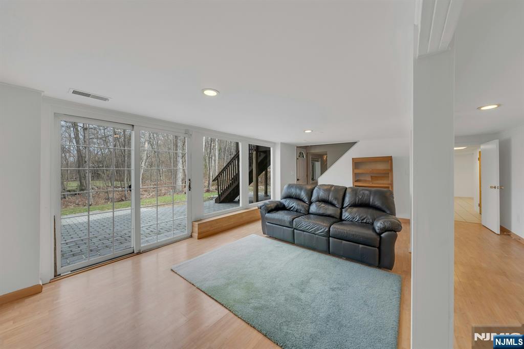 27 Bear Mountain Road Ringwood, NJ 07456 - Photo 33 of 47 a living room with furniture and a large window