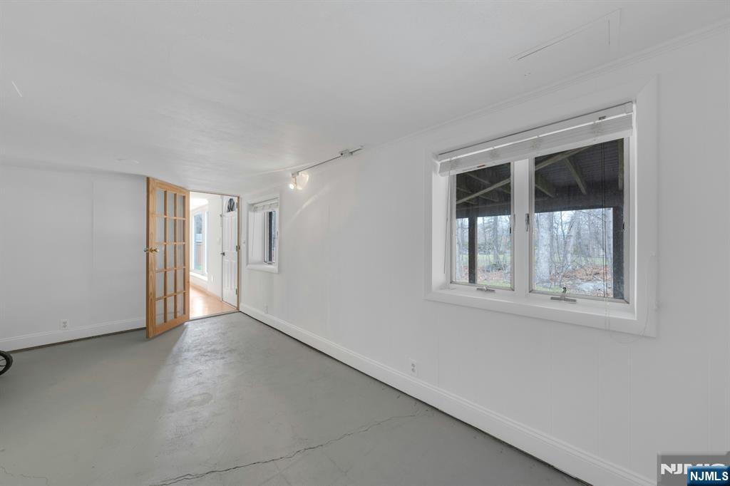 27 Bear Mountain Road Ringwood, NJ 07456 - Photo 35 of 47 an empty room with windows and closet