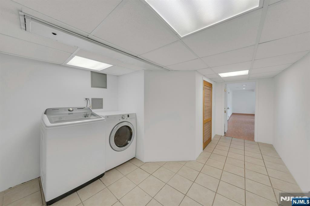 27 Bear Mountain Road Ringwood, NJ 07456 - Photo 37 of 47 a view of a storage & utility room with washer and dryer