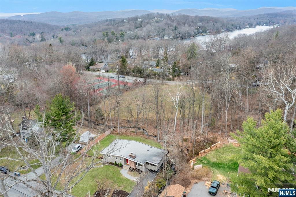 27 Bear Mountain Road Ringwood, NJ 07456 - Photo 41 of 47 an aerial view of a house with a yard