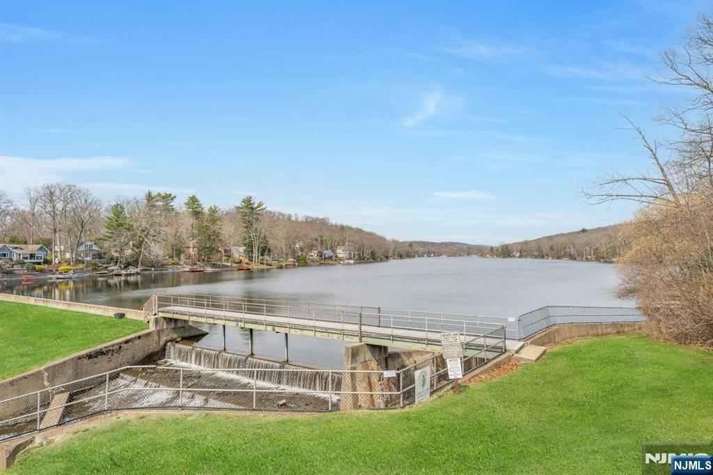 27 Bear Mountain Road Ringwood, NJ 07456 - Photo 6 of 47 a view of a lake with houses in the back