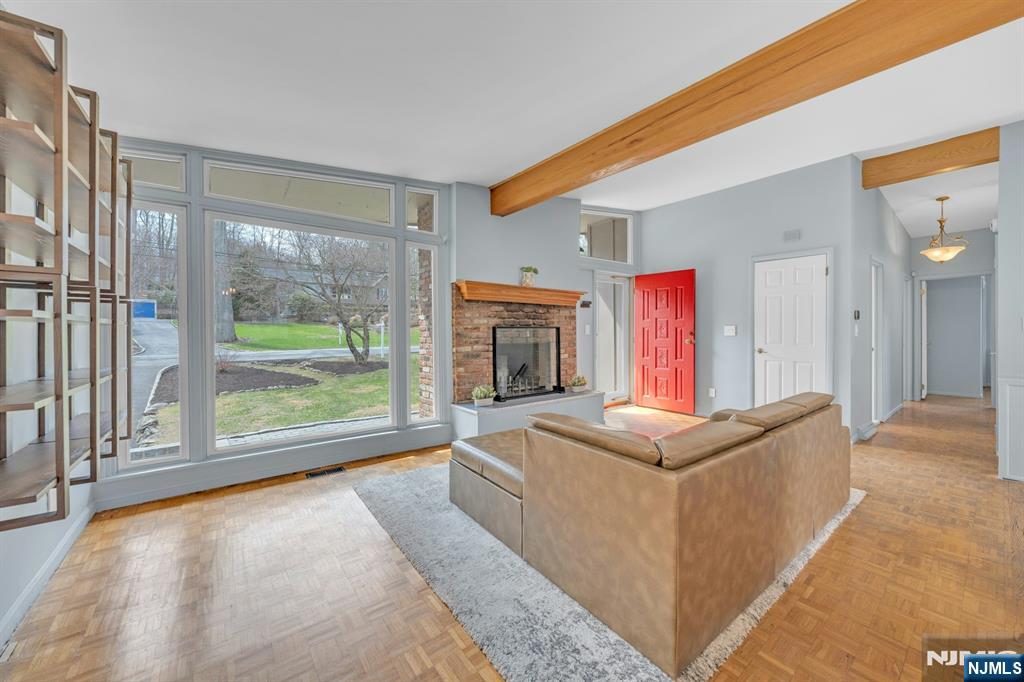 27 Bear Mountain Road Ringwood, NJ 07456 - Photo 9 of 47 a living room with stainless steel appliances granite countertop furniture and a fireplace
