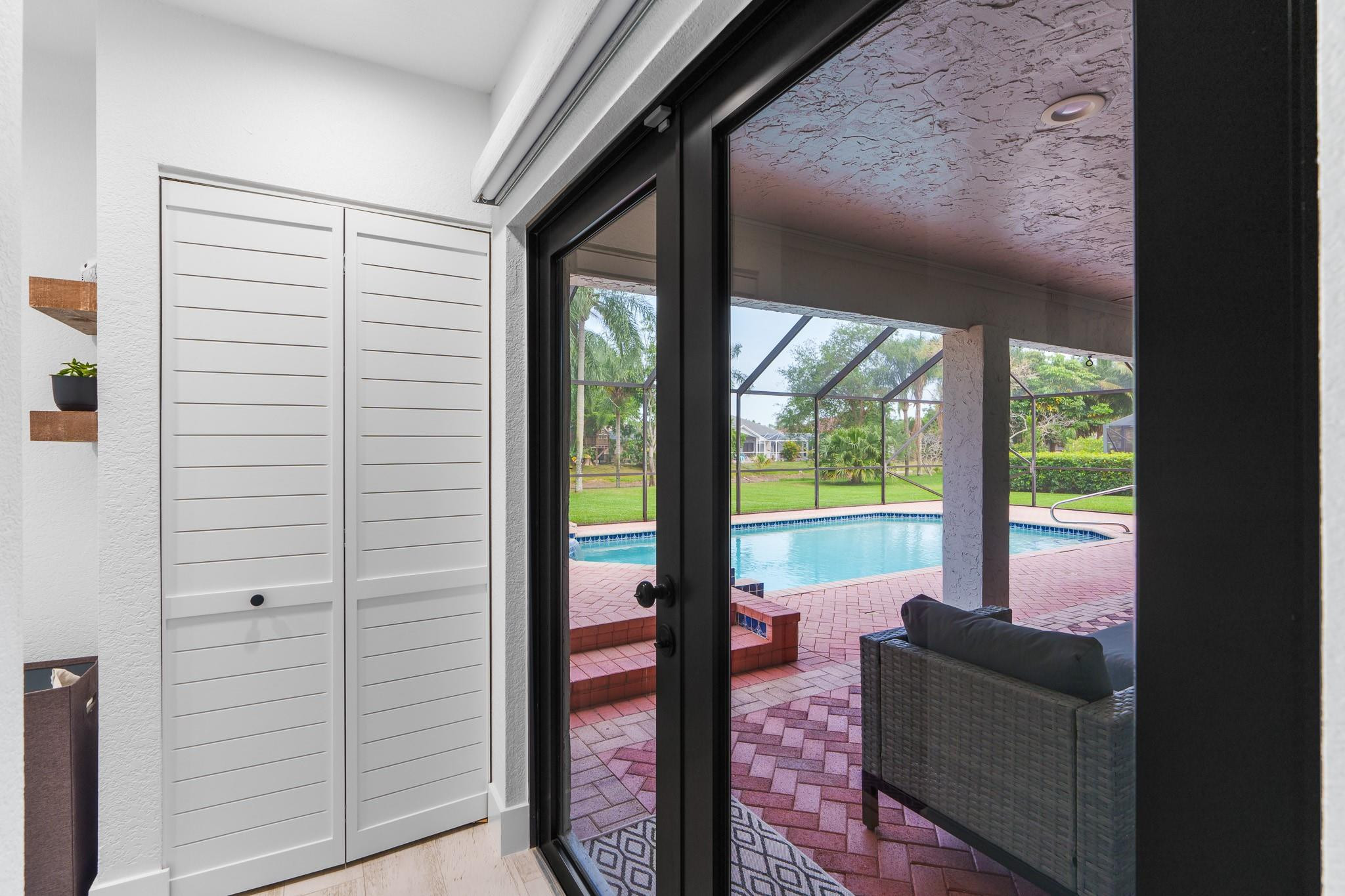 18242 102nd Way South Boca Raton, FL 33498 - Photo 35 of 64 French doors to pool area