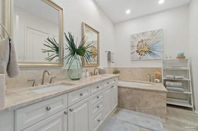 a bathroom with a granite countertop sink a mirror and a