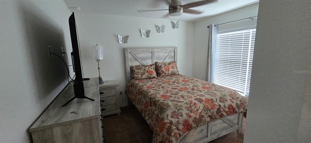 1108 Caloosa Ridge Way Babson Park, FL 33827 - Photo 15 of 29 a bed sitting in a room next to a window