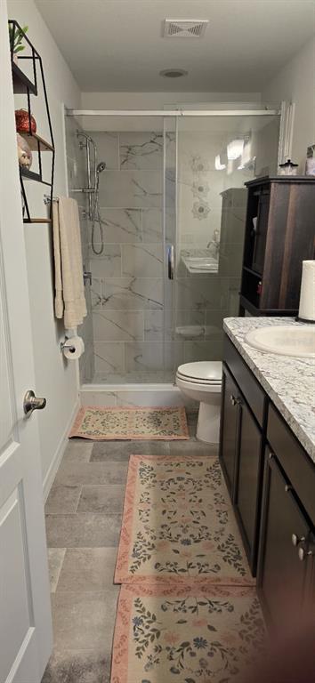 1108 Caloosa Ridge Way Babson Park, FL 33827 - Photo 19 of 29 a bathroom with a granite countertop sink toilet and shower