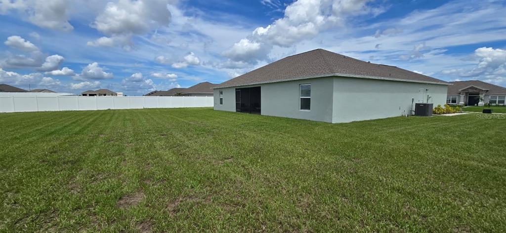 1108 Caloosa Ridge Way Babson Park, FL 33827 - Photo 26 of 29 a house with a yard