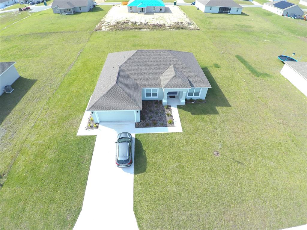 1108 Caloosa Ridge Way Babson Park, FL 33827 - Photo 29 of 29 a view of a swimming pool with a yard