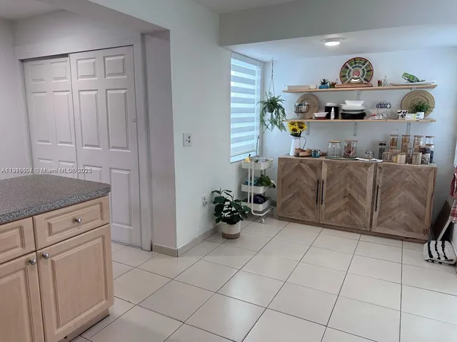 a view of a livingroom with furniture and a table
