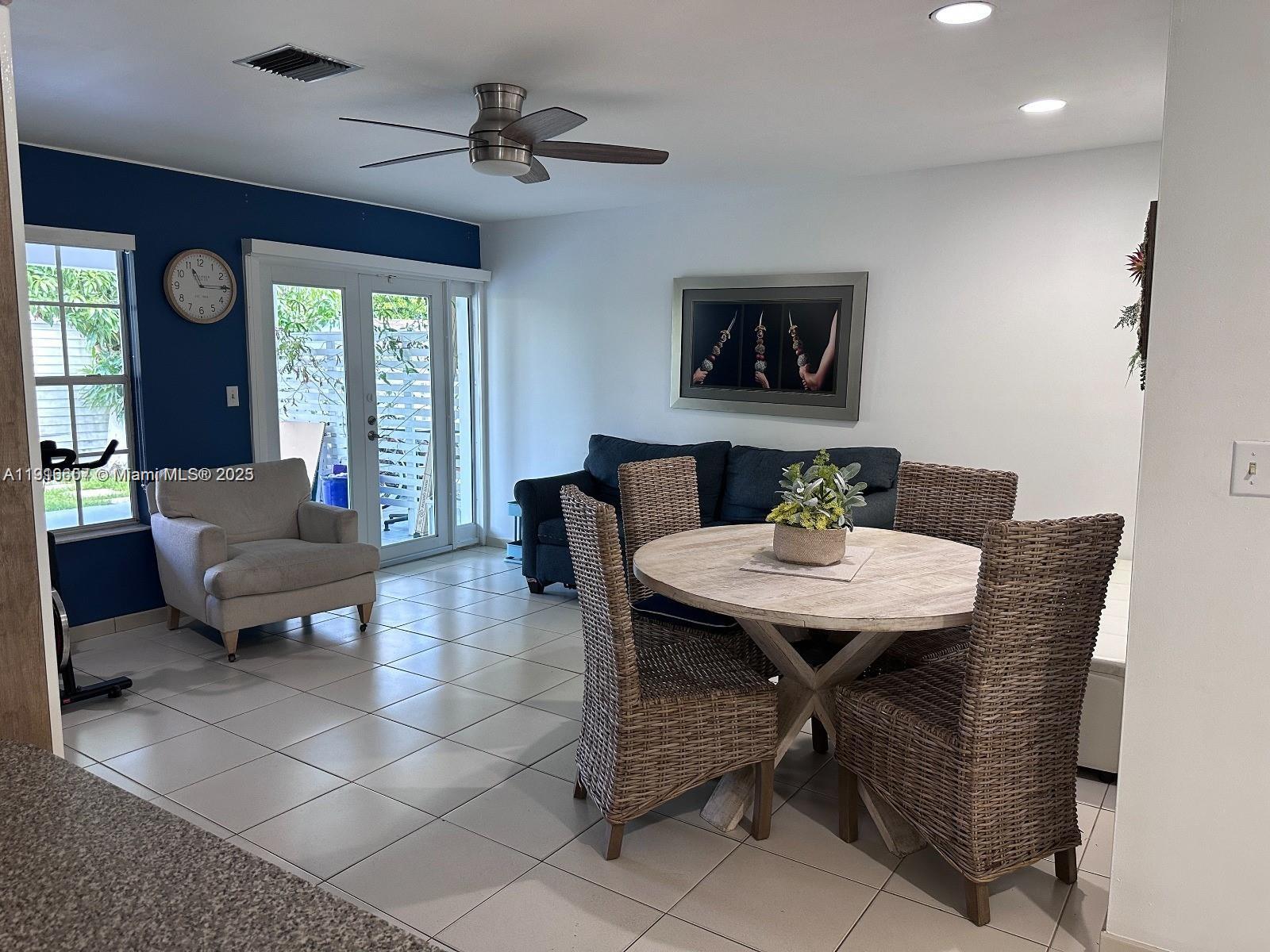 6174 West 14th Court, Unit 1 Hialeah, FL 33012 - Photo 15 of 24 a view of a livingroom with furniture and a table