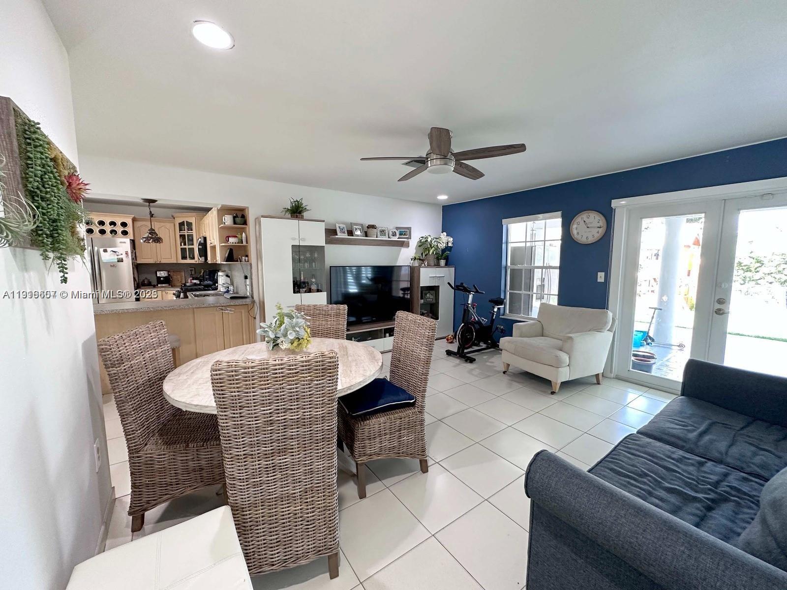 6174 West 14th Court, Unit 1 Hialeah, FL 33012 - Photo 17 of 24 a living room with furniture and a large window