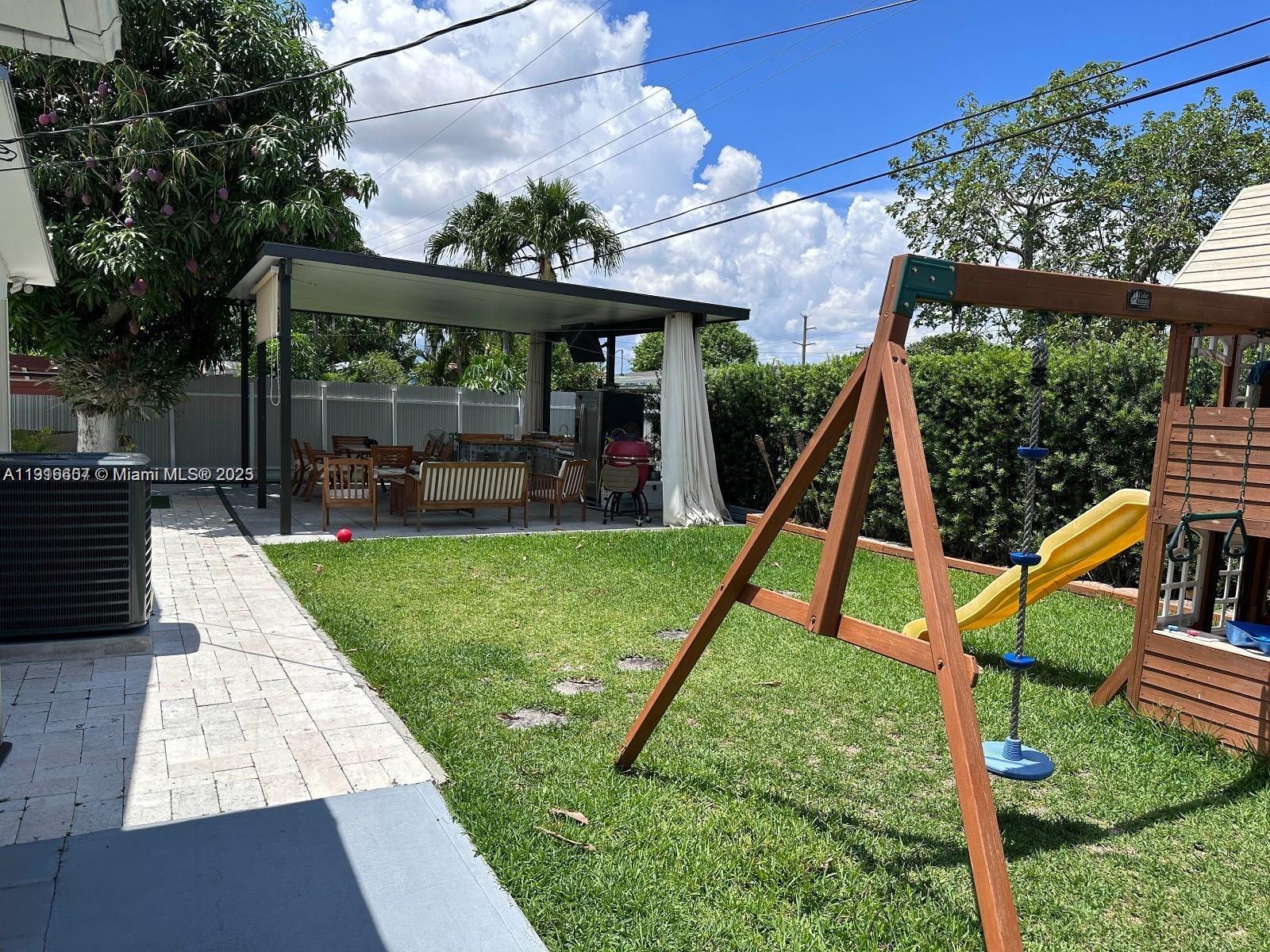 6174 West 14th Court, Unit 1 Hialeah, FL 33012 - Photo 23 of 24 a view of a house with a backyard