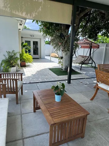 swimming pool view with a seating space