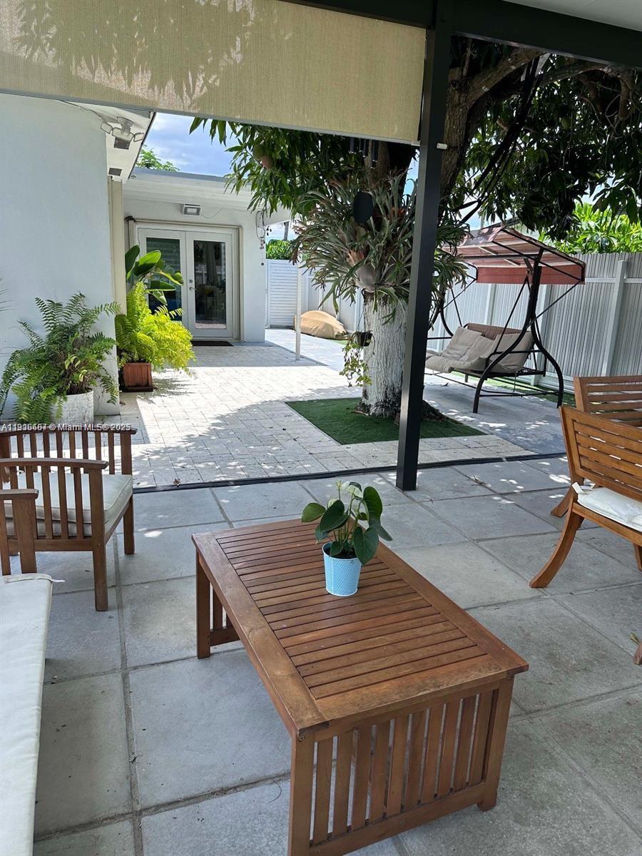 6174 West 14th Court, Unit 1 Hialeah, FL 33012 - Photo 4 of 24 swimming pool view with a seating space