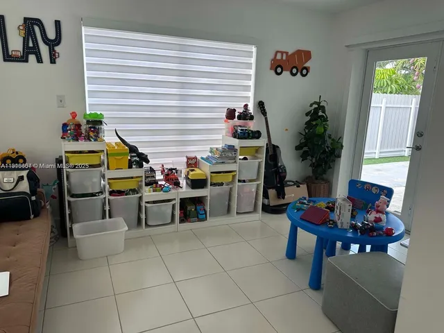 a kitchen with a table and chairs in it