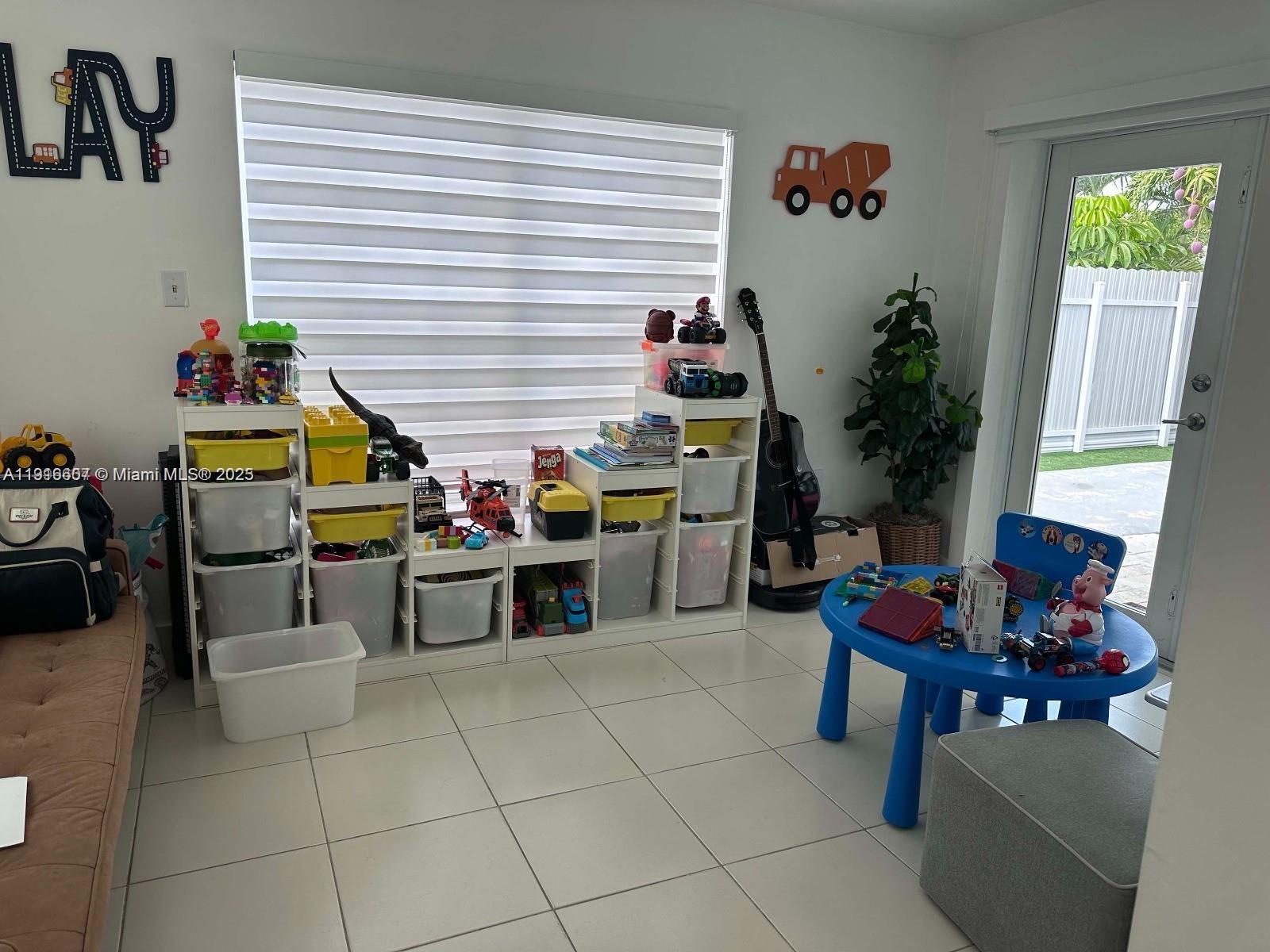 6174 West 14th Court, Unit 1 Hialeah, FL 33012 - Photo 9 of 24 a kitchen with a table and chairs in it