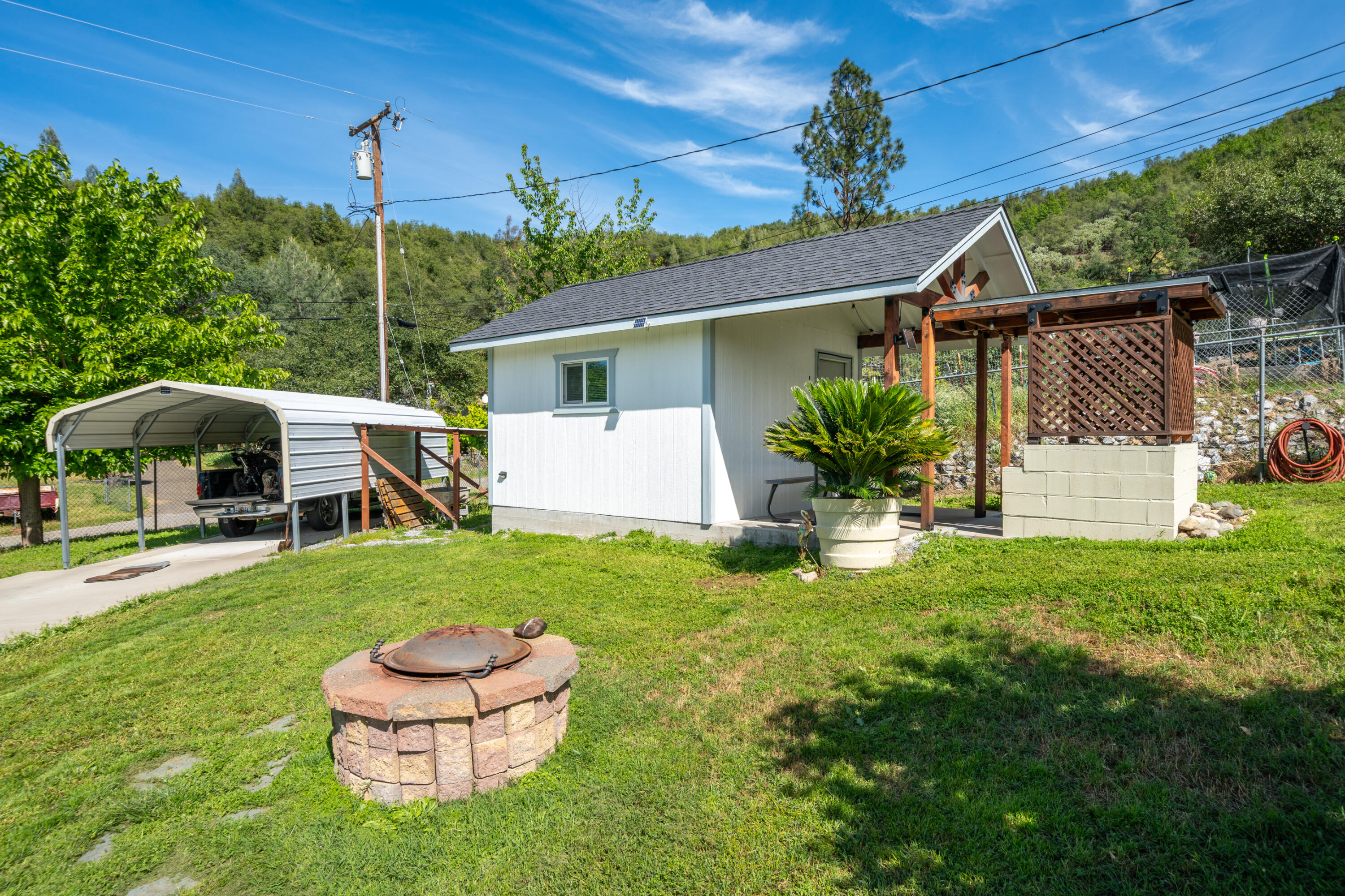 22151 Ravine Court Redding, CA 96003 - Photo 21 of 34 a house view with a garden space