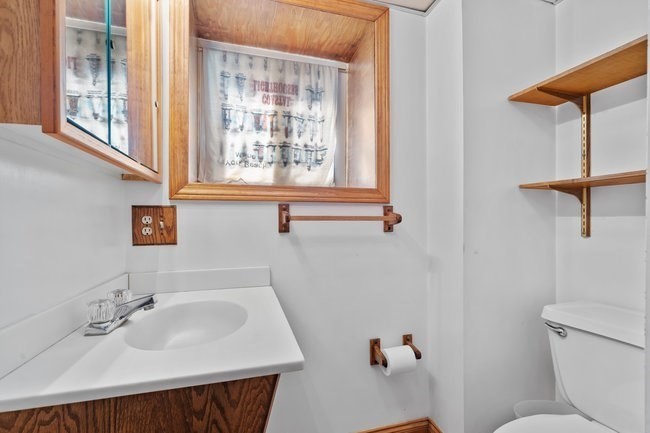 53 Windsor Street Everett, MA 02149 - Photo 12 of 20 a bathroom with a sink and a toilet