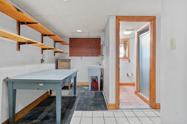53 Windsor Street Everett, MA 02149 - Photo 13 of 20 a view of a hallway with seating area